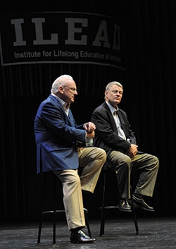 Richard A. Clarke (left) and Rand Beers ’64 on stage