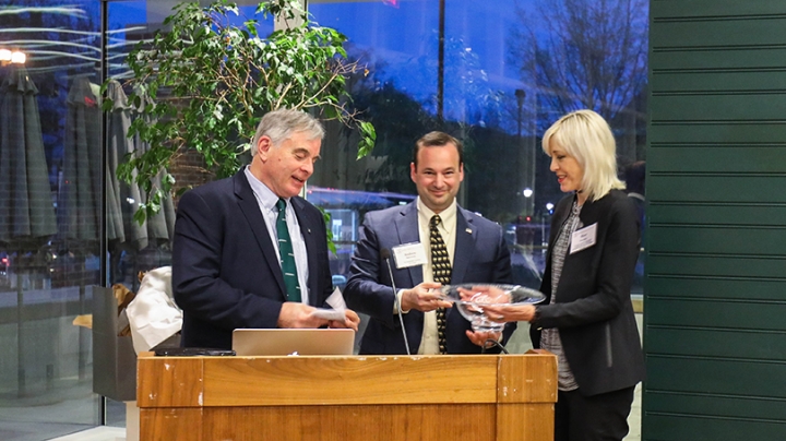 Robert Bartles ’64, left, and Rockefeller Center Director Andrew Samwick present the Class of 1964 Outstanding Leadership Award to Professor Mary Flanagan, founder of Tiltfactor Lab. 