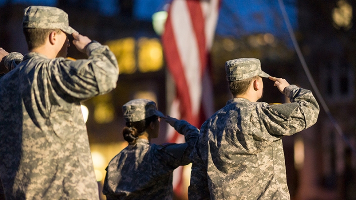 Dartmouth ROTC members salute the flag.