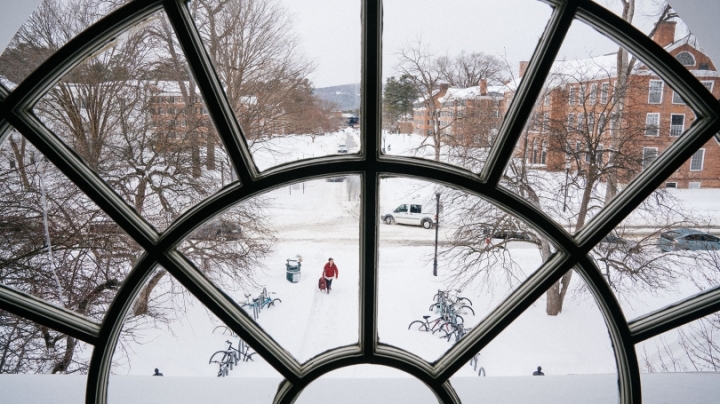 a round window in the library looking out over the Dartmouth Green covered in snow