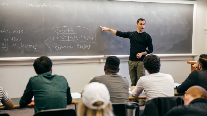 Professor Samuel Levey teaching a philosophy class, standing at a blackboard