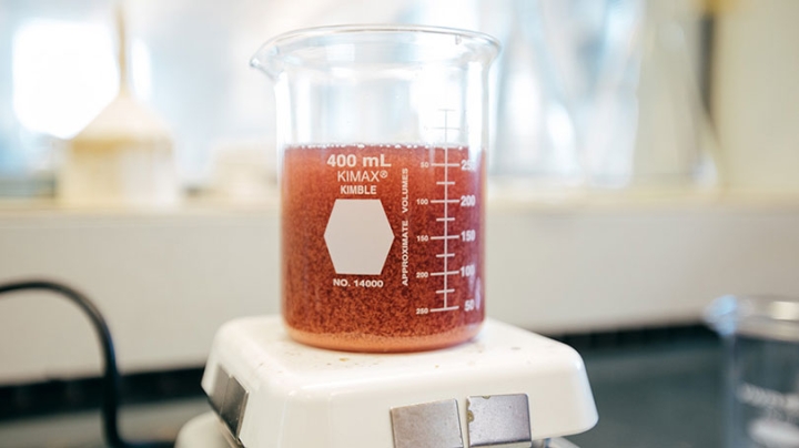 Glass beaker of liquid on a scale