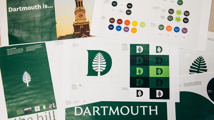 a pile of papers with Dartmouth's new logo on them