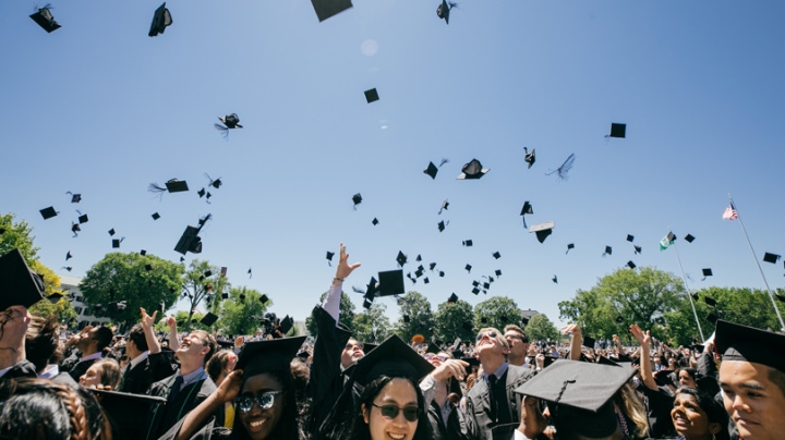 Students throw their caps in the air at the end of the 2019 commencement ceremony