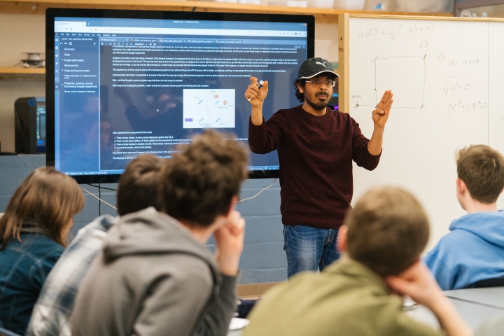 Kanav Setia, Guarini '20, teaches a class in quantum computing to seniors at Hanover High School. 
