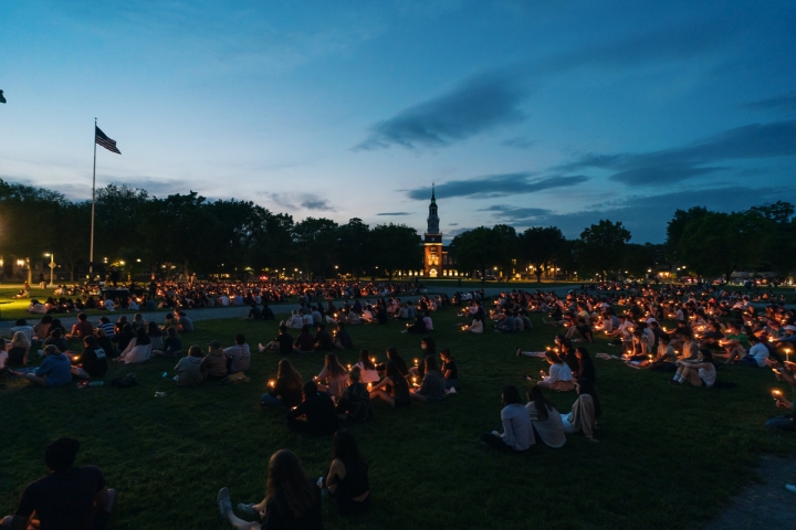 About a thousand members of the Dartmouth community gathered on the Green for a candlelight vigil in memory of the four undergraduates who died this academic year.