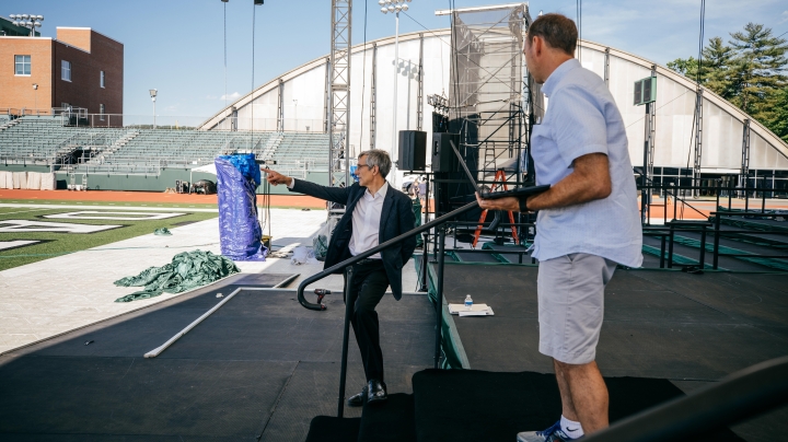 Provost Joe Helble and EJ Kiefer during commencement set-up