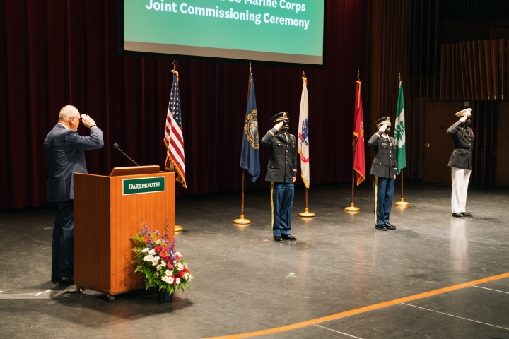 President Emeritus James Wright salutes, from left, U.S. Army 2nd Lt. Jaeyoung Oh '21, U.S. Army 2nd Lt. Jacob Rozak '21, and U.S. Marine Corps 2nd Lt. Robert Hobart III '21