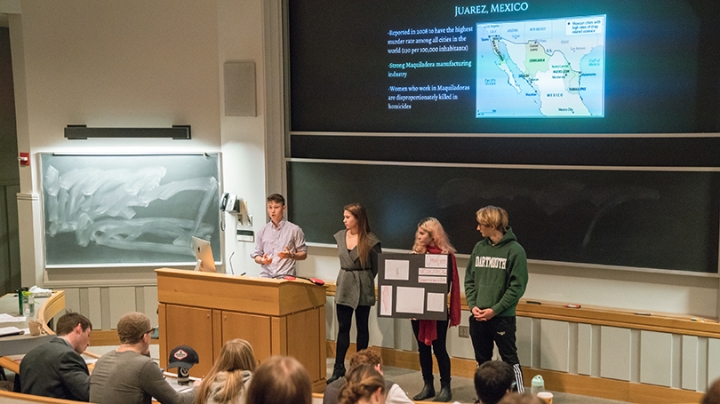 students giving a presentation in the Arts of War class