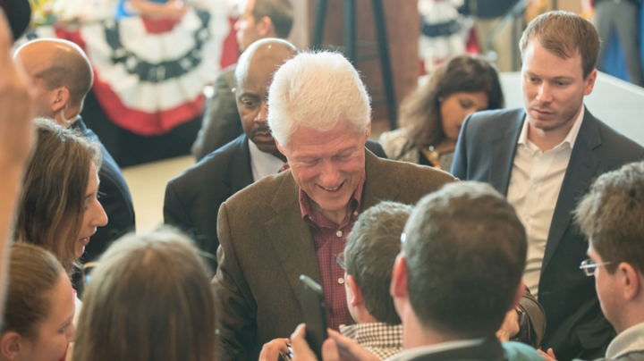 Bill Clinton signs autographs