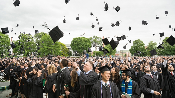 Students celebrate at the end of the commencement ceremony.