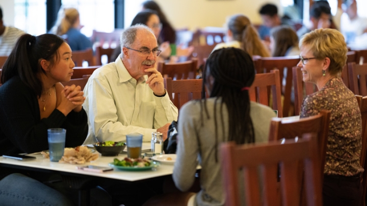 President Philip J. Hanlon '77 and Dean of the Faculty Elizabeth Smith talk with students at a lunchtime series with senior leaders that begins again this week. (Photo by Eli Burakian)