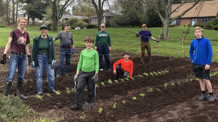 Dartmouth alumni and their families help grow organic vegetables as part of the Plant a Row for the Hungry project in Hartford, 