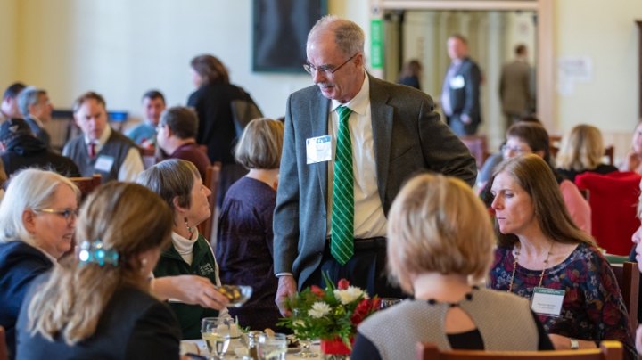 resident Philip J. Hanlon '77 chats with attendees at the annual employee service awards banquet last month. CREDIT: Photos by Lars Blackmore