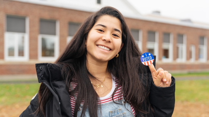 Donia Tung '22 shows off her "I Voted" sticker after casting her ballot in the 2018 midterm election. 
