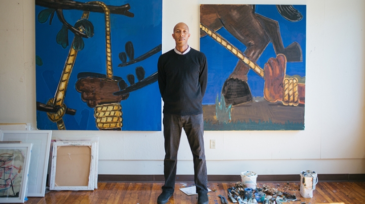 Enrico Riley paints in his studio in Lebanon, N.H.