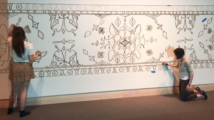 Hood Museum intern Eva Munday ’16, left, created this design for the paint-by-numbers mural activity. 