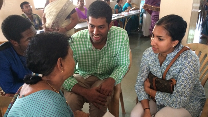 students interviewing a patient at an eye clinic in India