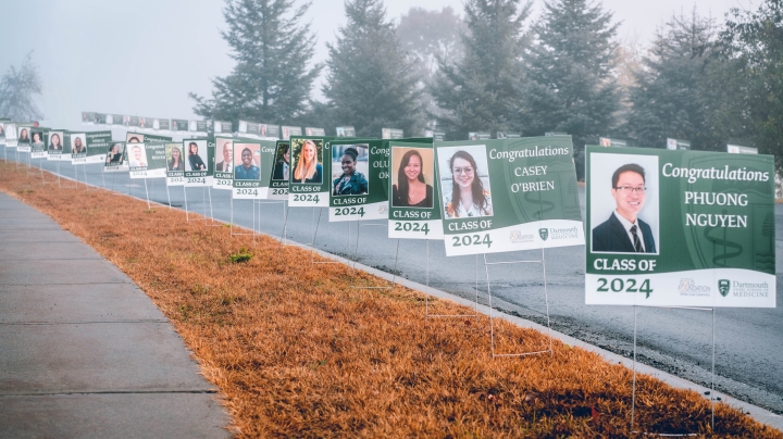 Posters of new medical students along a road