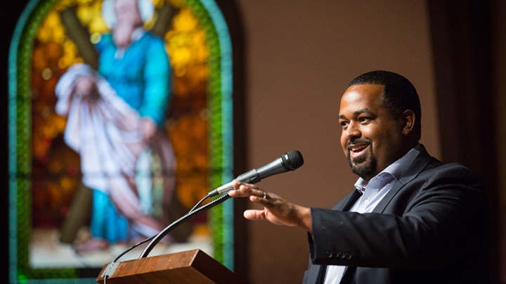 Joshua DuBois speaking at a podium