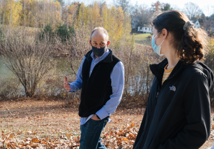 Bill Hudenko, a research assistant professor of psychological and brain sciences, talks with Ariela Feinblum '23 during a weekly walk with students around Occom Pond.