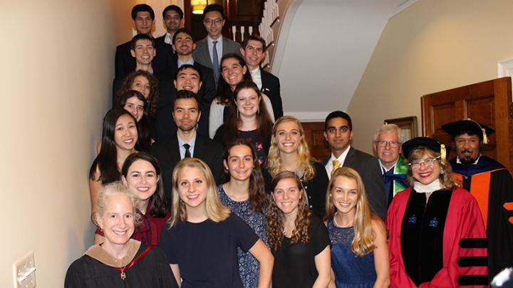 professors and the Phi Beta Kappa students standing together on a staircase