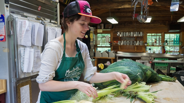 Sarah Carson shucking corn