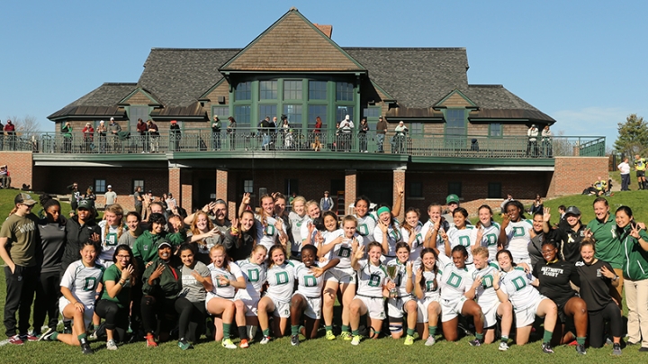 the Dartmouth women's rugby team standing together outside