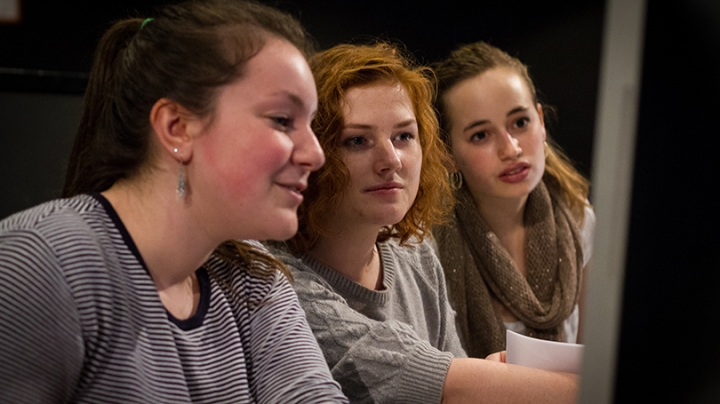 :) Jaclyn Pageau ’18, left, Lela Gannon ’18, center, and Tess McGuinness ’18 prepare for a rehearsal of Orwell 