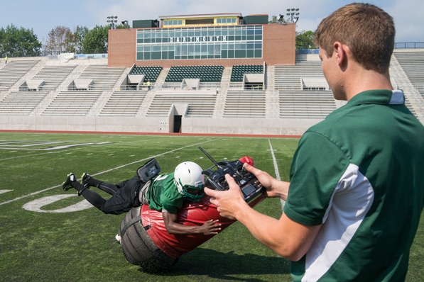 Victor Williams ’16 tackles the “Mobile Virtual Player,” Quinn Connell ’13, Thayer ’14, controls the device,