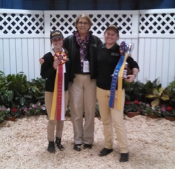 Two students with equestrian coach