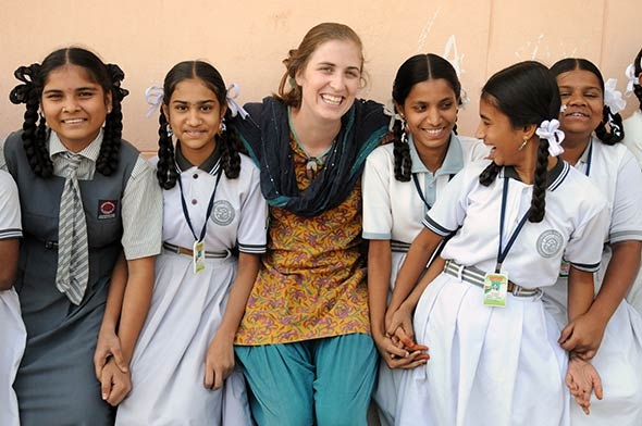 Averil Spencer ’10 with local girls from India