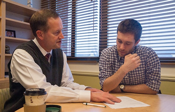 Roger Woolsey, director of the Center for Professional Development, advises Sam Farnham ’14