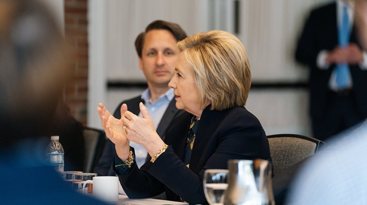 Hillary Rodham Clinton speaks with students in the Dickey Center’s War and Peace Fellows as program coordinator Benjamin Valentino listens.