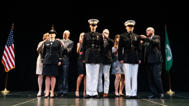 Alexandra Crosswait ’19, Frederick Polak ’19, and Austen Robinson ’19 are pinned with the insignia of the rank of second lieutenant by their families at the Dartmouth joint commissioning ceremony on Saturday