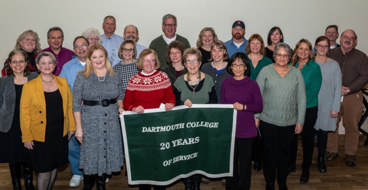 Employees who have worked for 20 years for the college stand together for a group photo