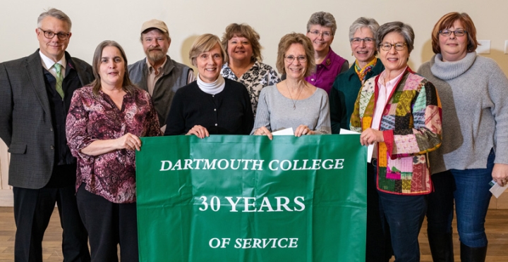 Employees who have worked for 30 years for the college stand together for a group photo