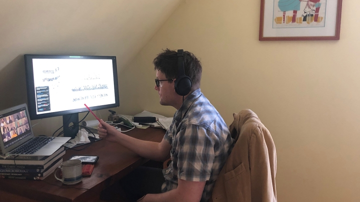 William Leavitt, an assistant professor of earth science and an adjunct assistant professor of chemistry and biological sciences, listens to Akshay Mehra, a Neukom Fellow, speak over Zoom to Leavitt's geobiology class. Mehra gave a guest lecture on his &quot;v