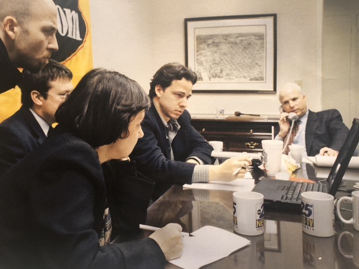 During the 2000 presidential campaign, Sen. John McCain, far right, talks to reporters, including, at far left, Justin Anderson, then a reporter for ABC, and, second to right, Jake Tapper ’91, then a reporter for Salon.