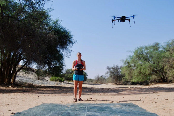 Bryn Morgan flying a drone for a research project on the Kuiseb River in the Namib Desert. Photo by Oliver Halsey.