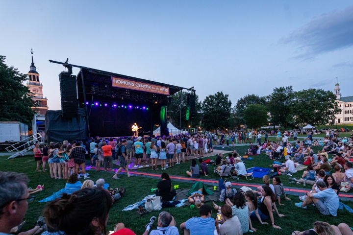 The crowd, some lounging on blankets spread out on the Green and others gathered close by the stage, enjoying the concert. (Photo by Lars Blackmore)