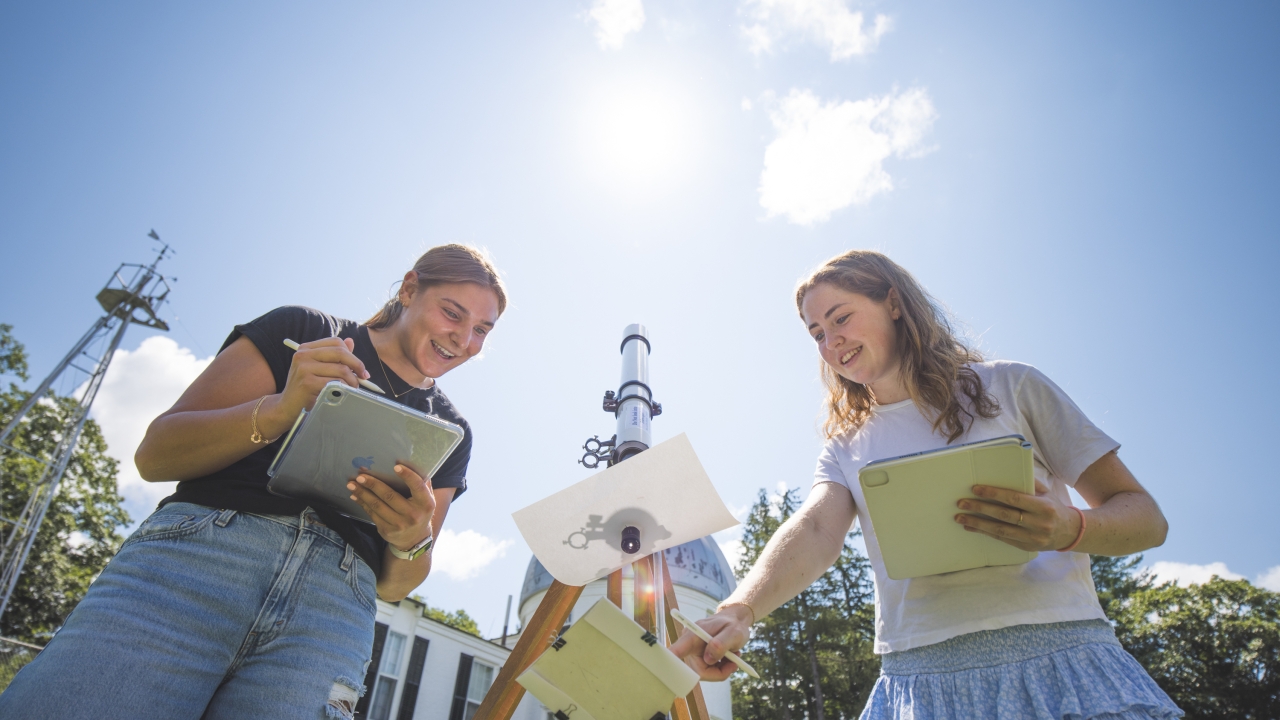 Students studying the sun's shadow