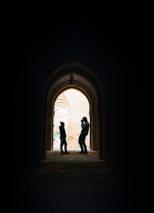 Two students silhouettes in a window
