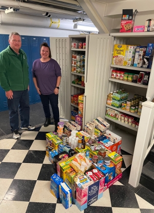 Joe Dempsey and Dominique Walton at the food pantry in Dick's house