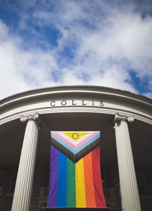 Pride flag hangs from Collis columns.