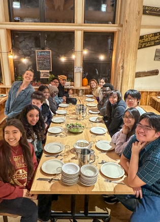 Students at a table in Moosilauke Ravine Lodge