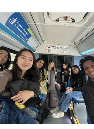 A group of students takes the bus