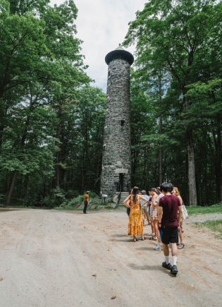A group of students visiting Bartlett Tower